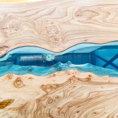 Texture of a wooden table with epoxy resin. Top view of wood for background